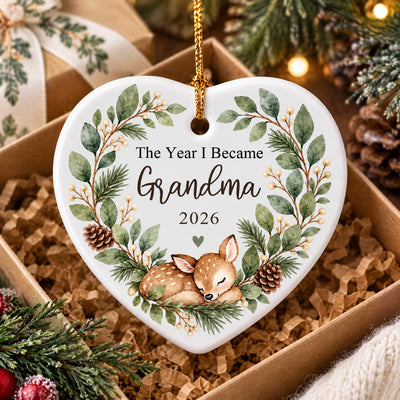 Personalized Ceramic Ornament Grandma Box heart in an open gift box with kraft paper filling and pinecones