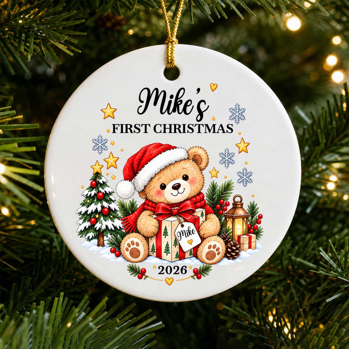 Personalized Ceramic Ornament First Christmas with teddy bear in Santa hat, hanging on a tree with warm lights