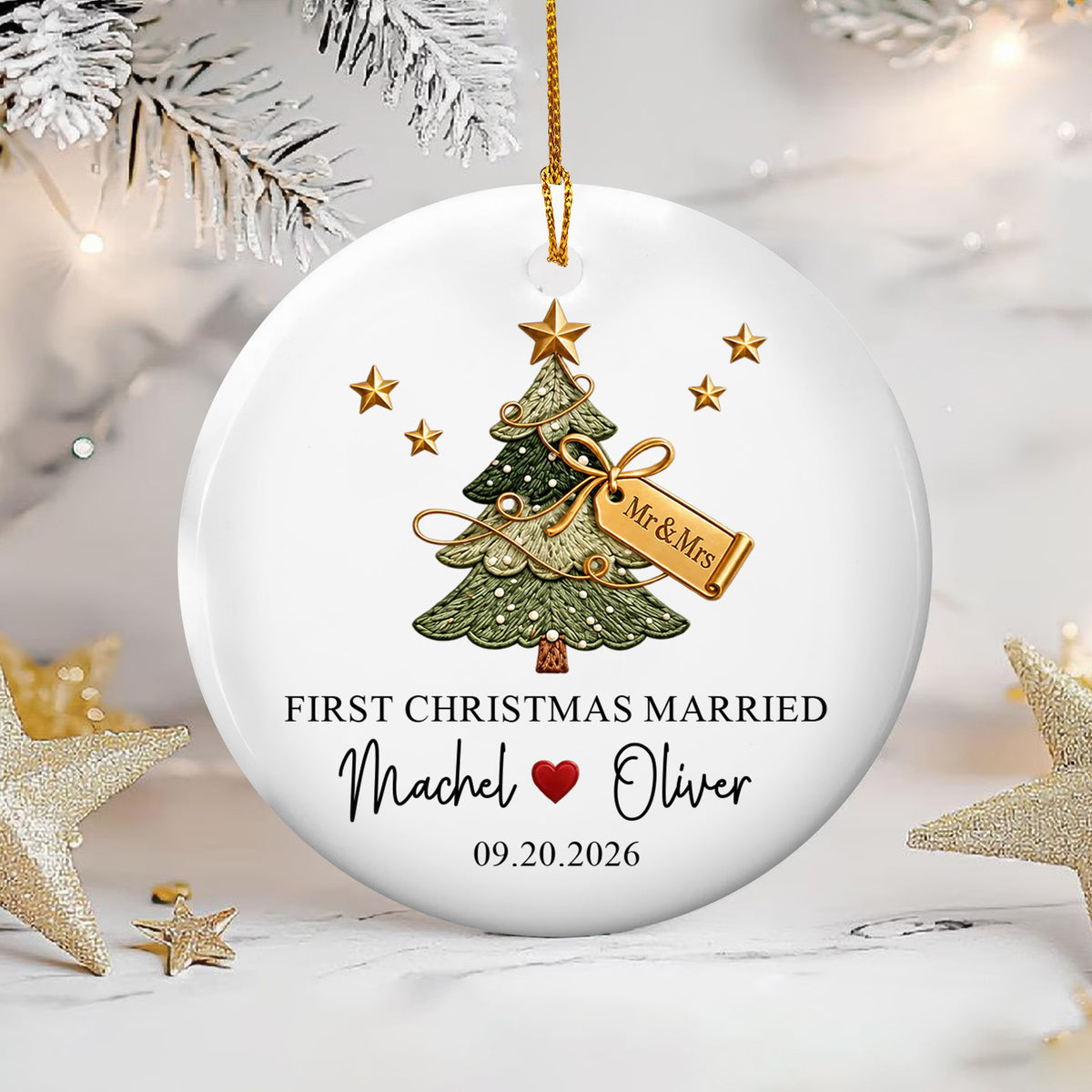 Personalized ceramic ornament First Christmas Married with gold stars and frosted branches on a white surface