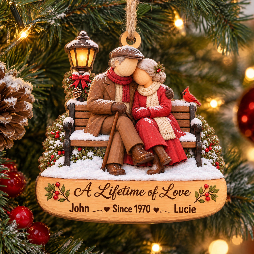 Personalized Wooden Couple Christmas Ornament hanging on a pine branch, couple on a snowy bench with names John and Lucie