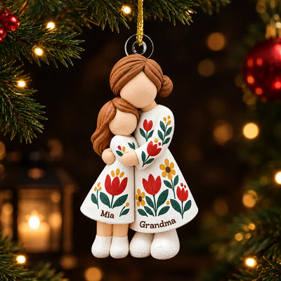 Personalized Grandmother Granddaughter Figurine Ornament hanging on a tree, names Mia and Grandma on floral dresses