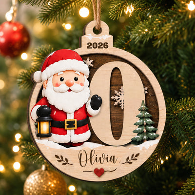 Personalized Santa Initial Wooden Ornament with letter O and the name Olivia, shown on a tree with red baubles