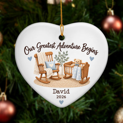 Personalized Ceramic Ornament Our Greatest Adventure Begins heart with blue design hanging on a pine tree