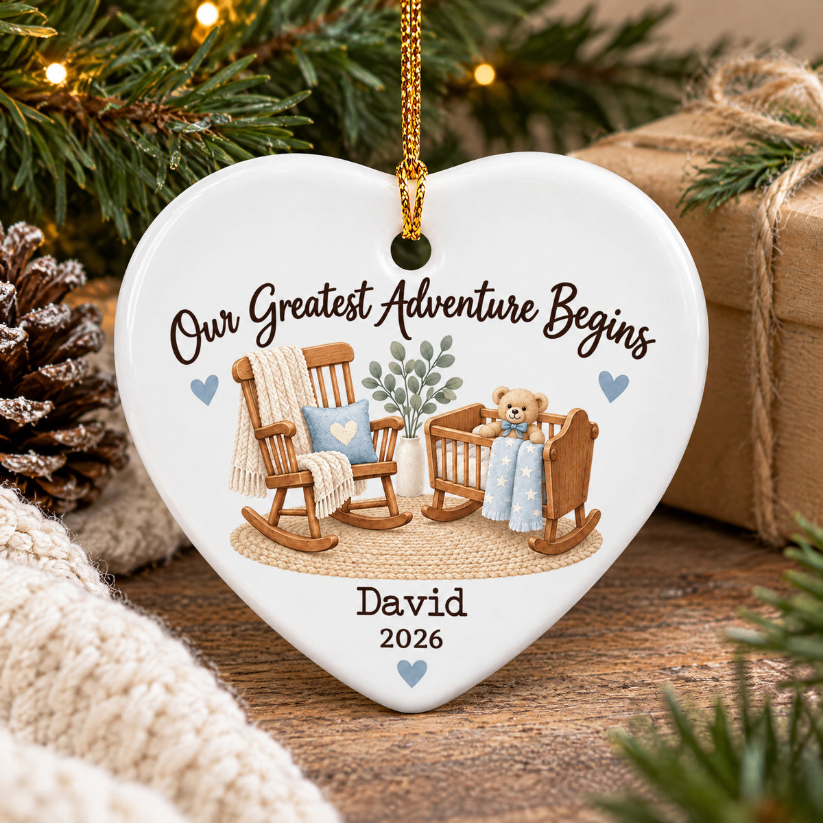 Personalized Ceramic Ornament Our Greatest Adventure Begins by a pinecone, wrapped gift and knit blanket