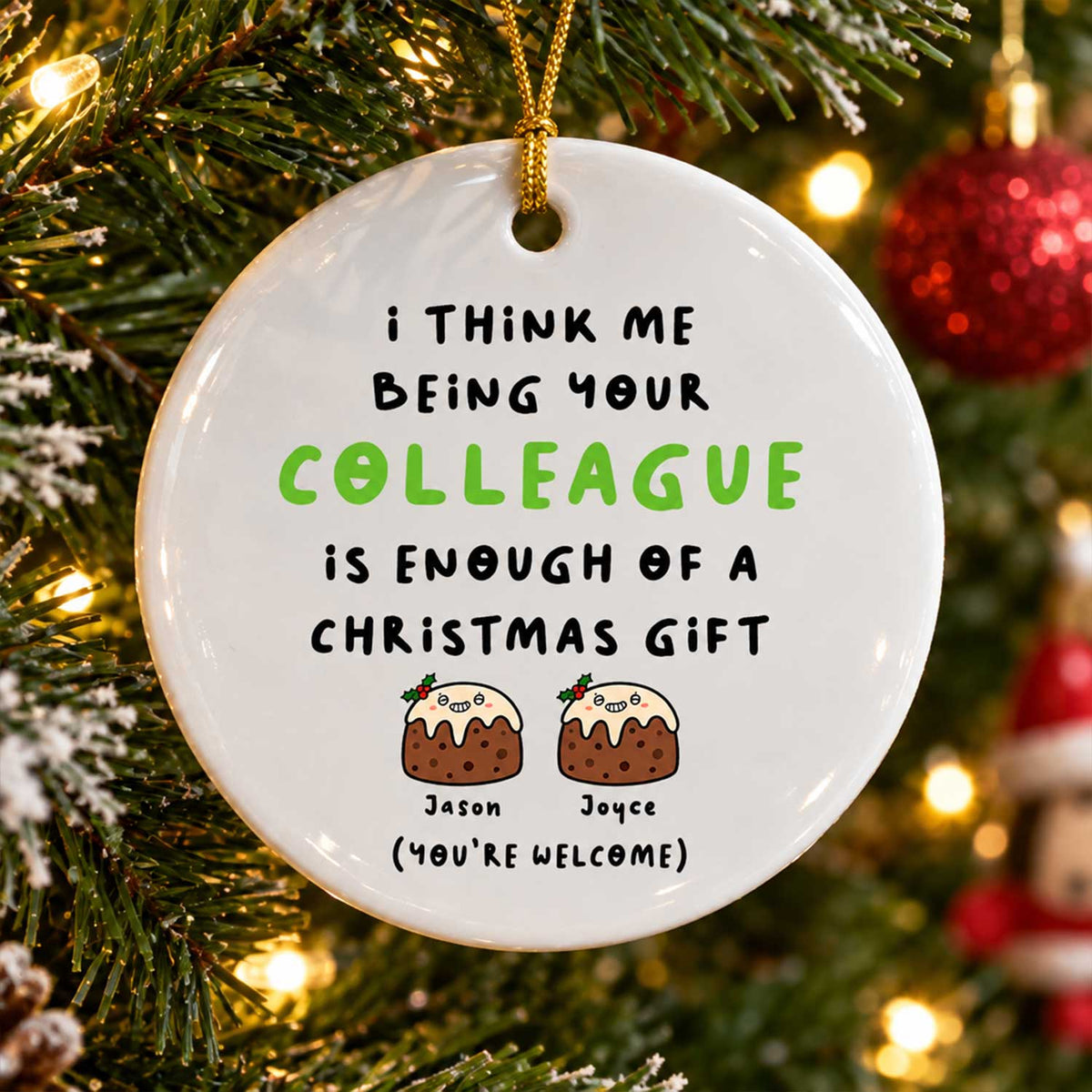 Personalized Colleague Christmas Gift Ceramic Ornament hanging on a tree with red baubles and two pudding characters