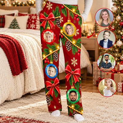 Personalized pajamas pants custom face ornament in red, worn in a bedroom with photo circles of faces beside them