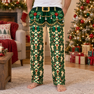 Funny holiday pajama pants close view of green holly print, gold belt design and bows beside a decorated tree