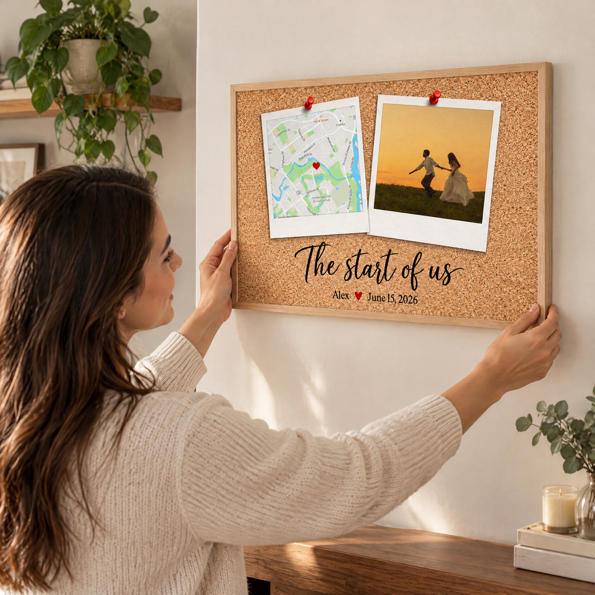 Personalized Polaroid Map and Photo Poster held up on a wall by a smiling woman in a knit sweater