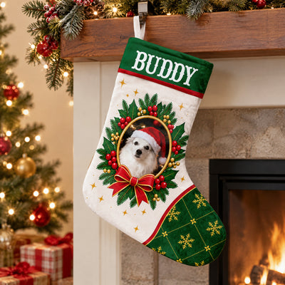 Personalized Christmas stocking custom name photo hanging from a wood mantel beside a lit tree and a glowing fireplace