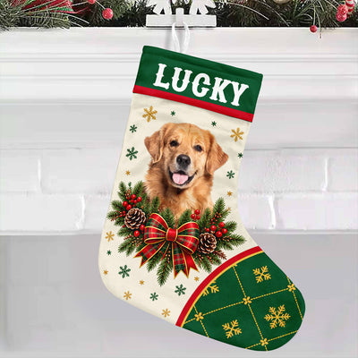 Personalized Christmas Stocking hanging from a snowflake hook on a white brick mantel with garland above