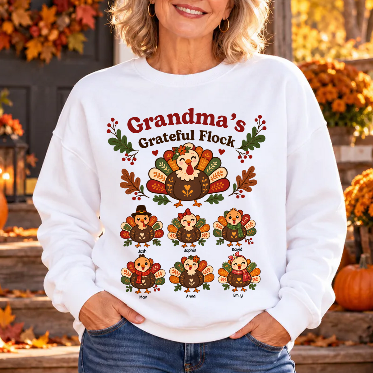 Grandma's Grateful Flock Personalized Sweatshirt worn by smiling woman with hands in pockets on an autumn porch