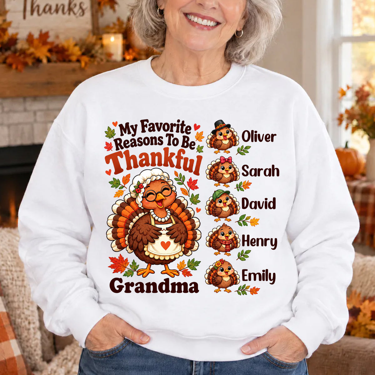 Personalized Sweatshirt My Favorite Reasons To Be Thankful worn by a smiling woman with hands in pockets by a fireplace