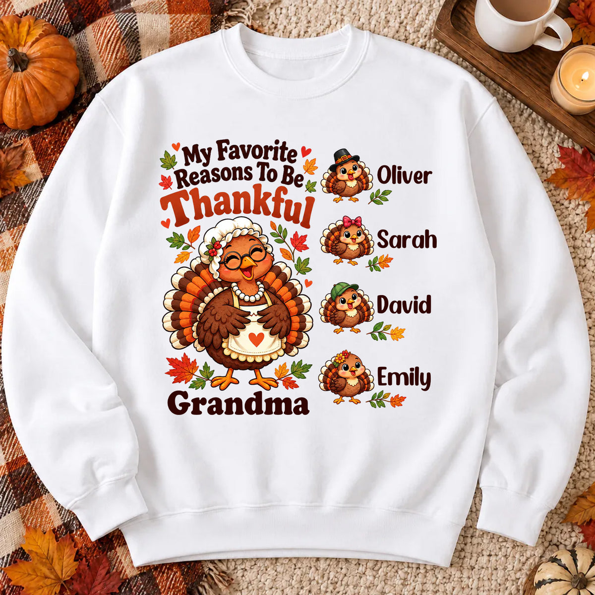 Personalized Sweatshirt My Favorite Reasons To Be Thankful laid flat with four turkey names on plaid blanket and pumpkins