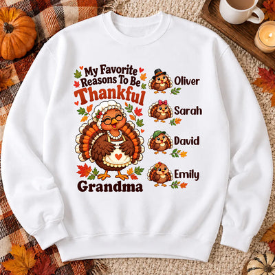 Personalized Sweatshirt My Favorite Reasons To Be Thankful laid flat with four turkey names on plaid blanket and pumpkins