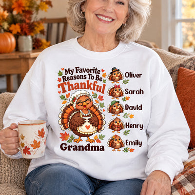 Personalized Sweatshirt My Favorite Reasons To Be Thankful worn by a smiling woman holding a mug on a couch