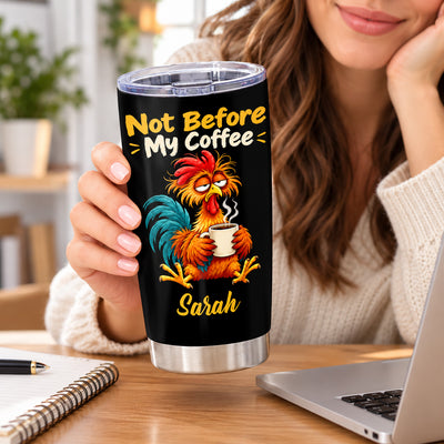 Personalized tumbler Not Before My Coffee held by a smiling woman at a desk with notebook and laptop
