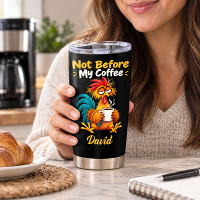 Personalized tumbler Not Before My Coffee held by a woman in a kitchen with a croissant on a plate