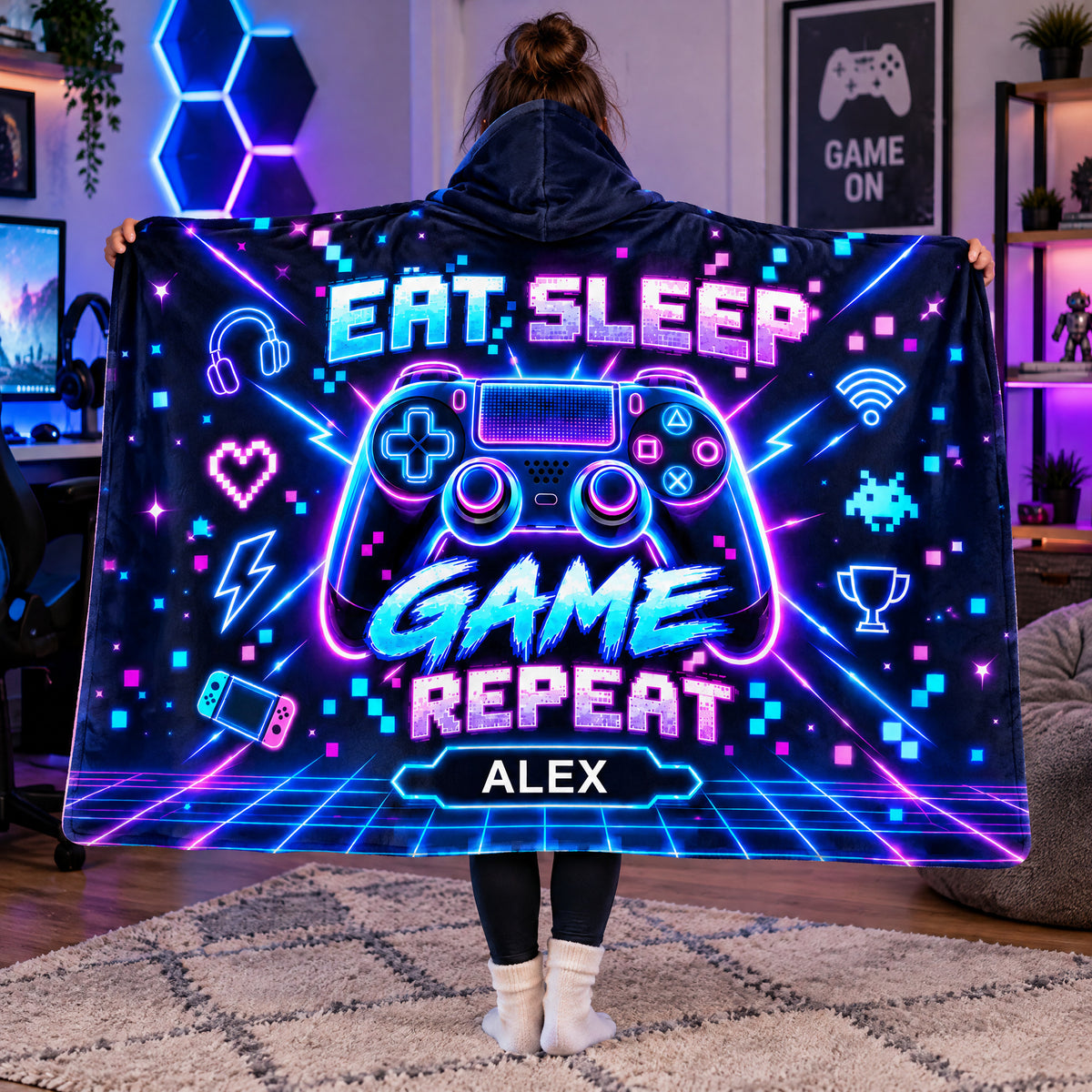Personalized wearable hooded blanket held open by a person in a gaming room with neon hexagon lights