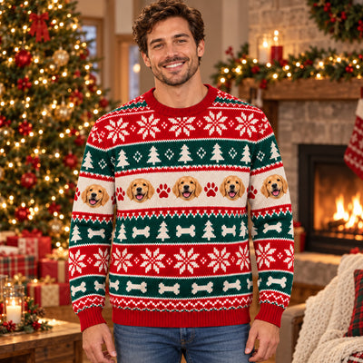 Personalized Pet Photo Christmas Sweater laid flat on a wood surface with holiday decor, dog faces and paw prints in a row