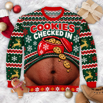 Custom Cookies Checked In Christmas Sweater laid flat on white fur with ornaments, a gingerbread toy and boots