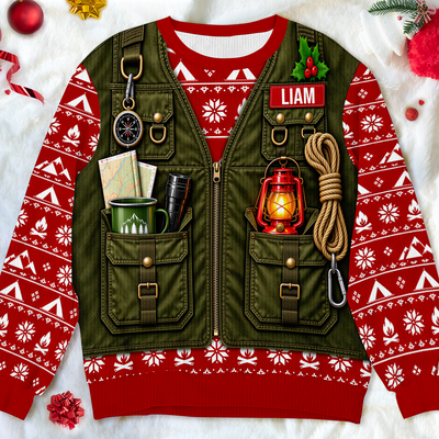 Personalized Merry Campmas wool sweater laid flat showing green vest print, lantern, rope and red name patch